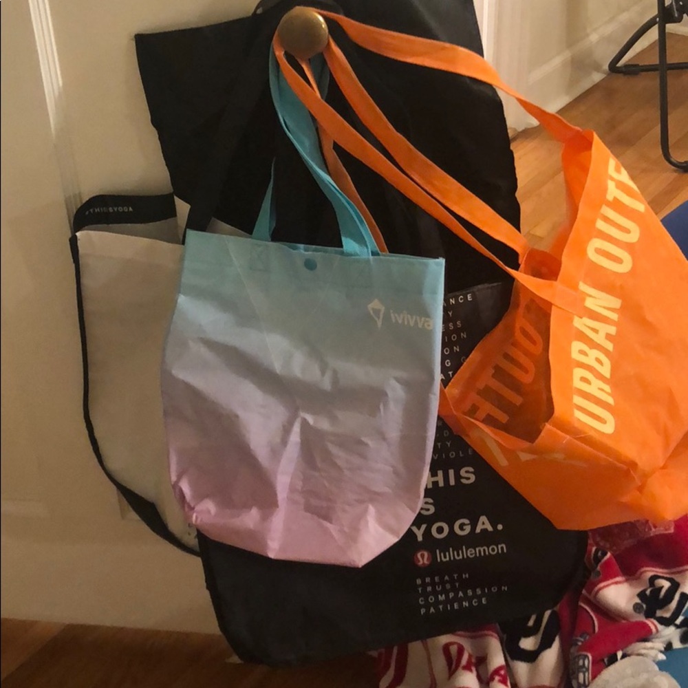 urban outfitters, ivviva, and lululemon bags